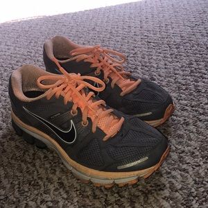 Grey and orange Nike tennis shoes